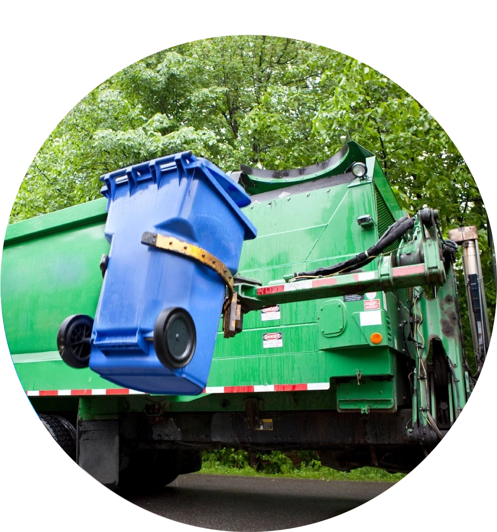 Garbage truck lifting blue bin.