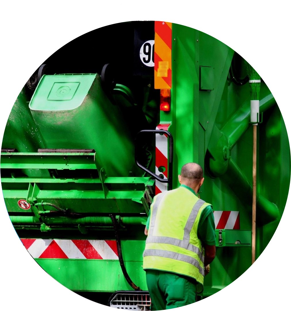 Worker with green garbage truck.