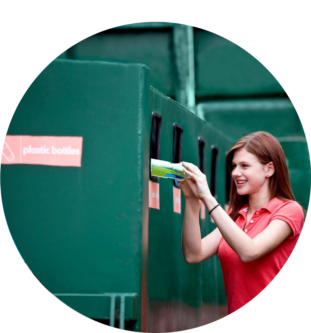 Woman recycling plastic bottle.